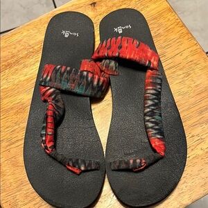 Sanuk Black and Red Sandals with Intricate Woven Straps